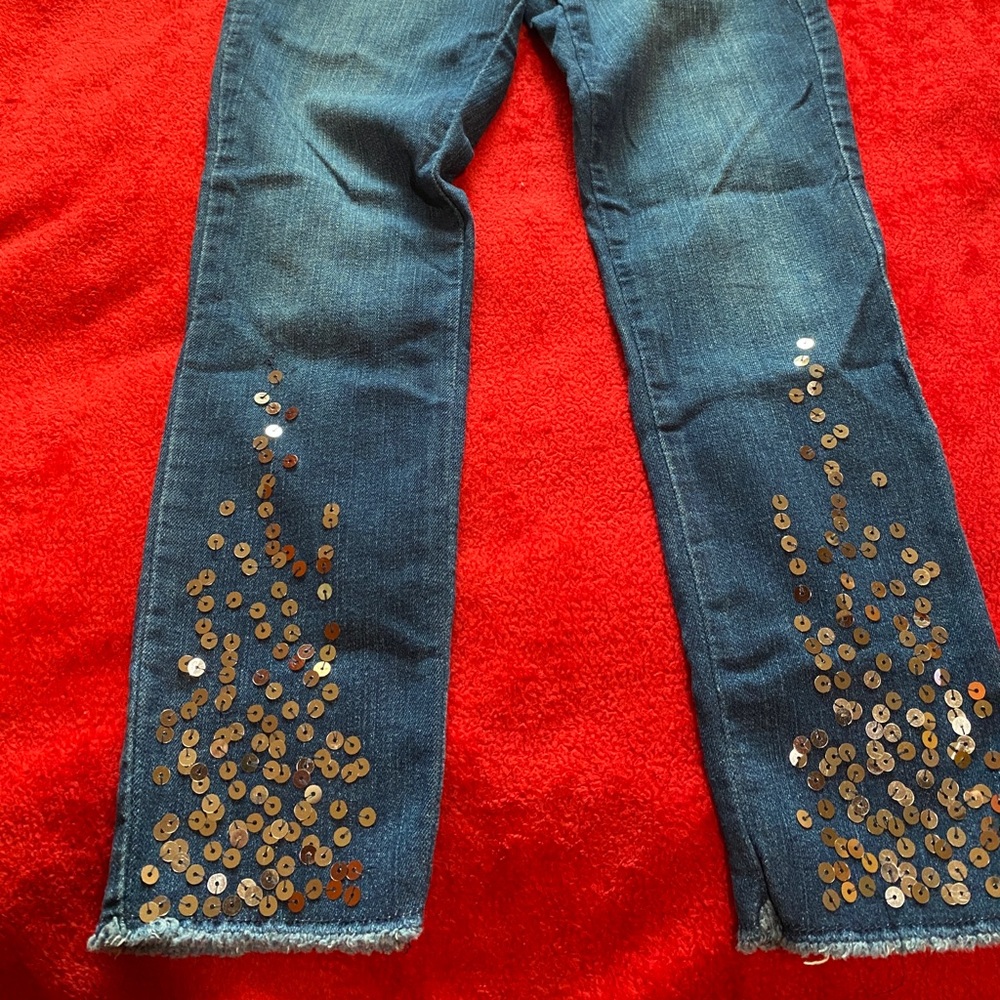 Size: 10, denim jeans, sequins at the bottom front of the jeans, high wasted
